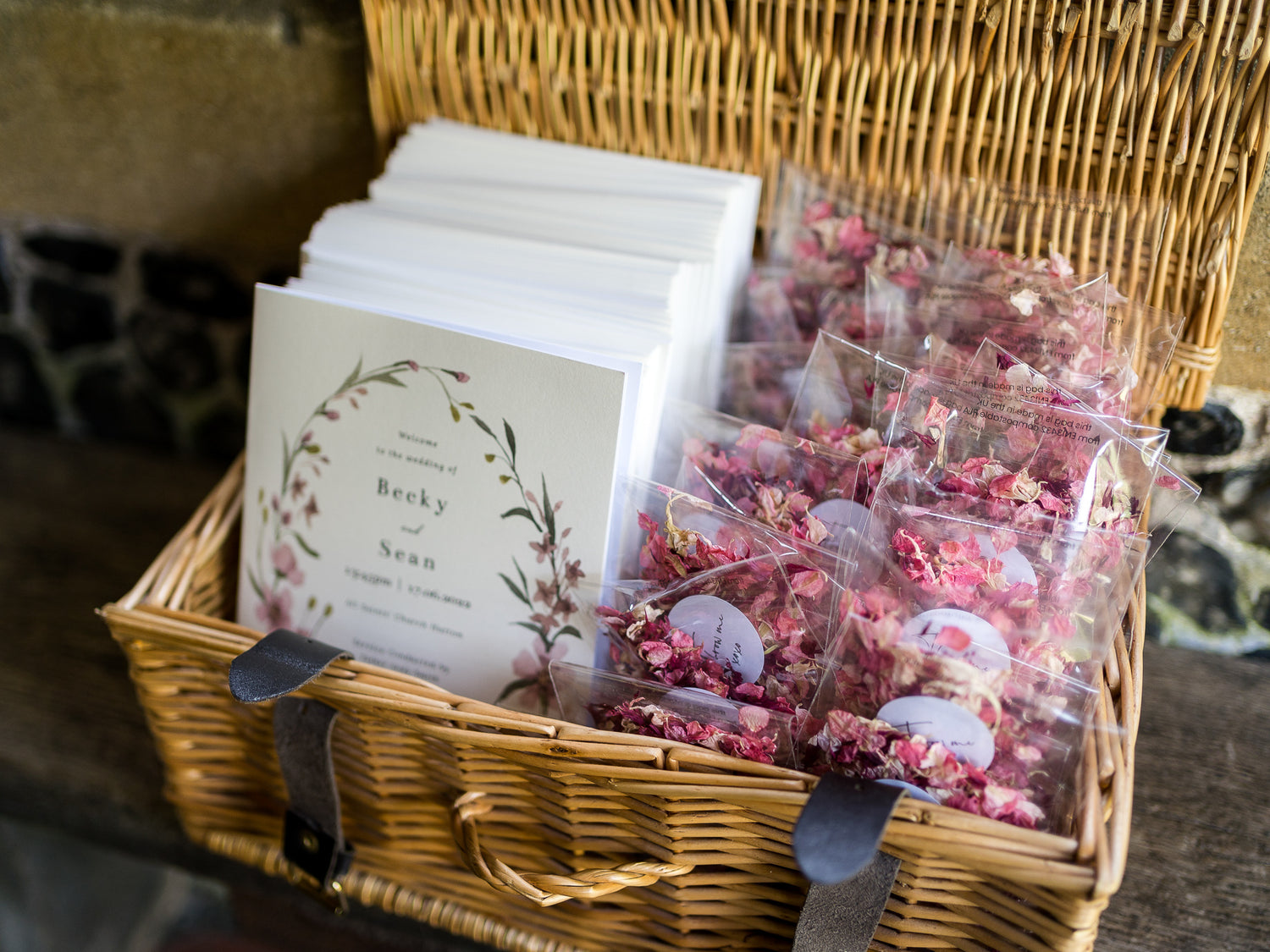 Wicker basket with confetti and wedding service orders